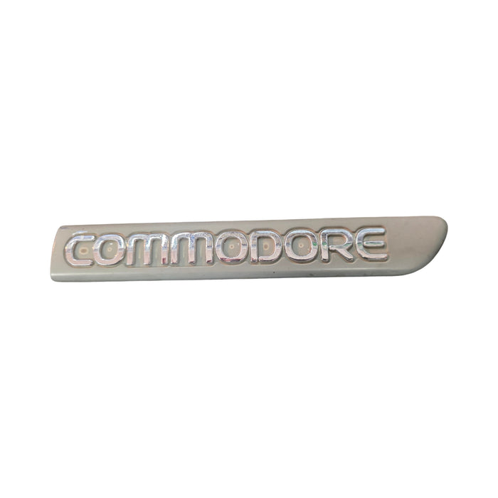 VS HOLDEN COMMODORE GUARD BADGE - "COMMODORE" Drivers Guard Badge