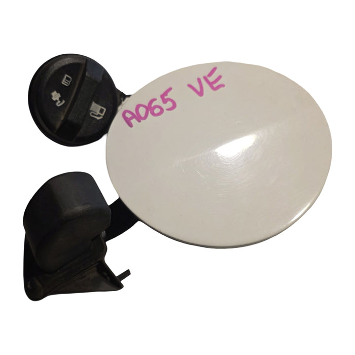 A065 - VE HOLDEN COMMODORE SEDAN - FUEL FLAP - HERON WHITE 679F