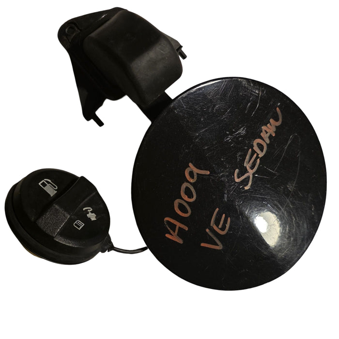 A009 - VE HOLDEN COMMODORE SEDAN - FUEL FLAP - PHANTOM black #690F