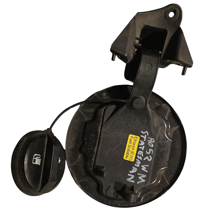 A052 - WM HOLDEN COMMODORE SEDAN - FUEL FLAP - BLACK 690F