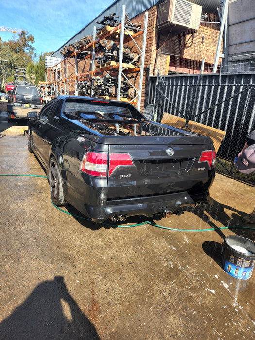 A047 - VE HOLDEN COMMODORE UTILITY - FUEL FLAP - PHANTOM BLACK #690F