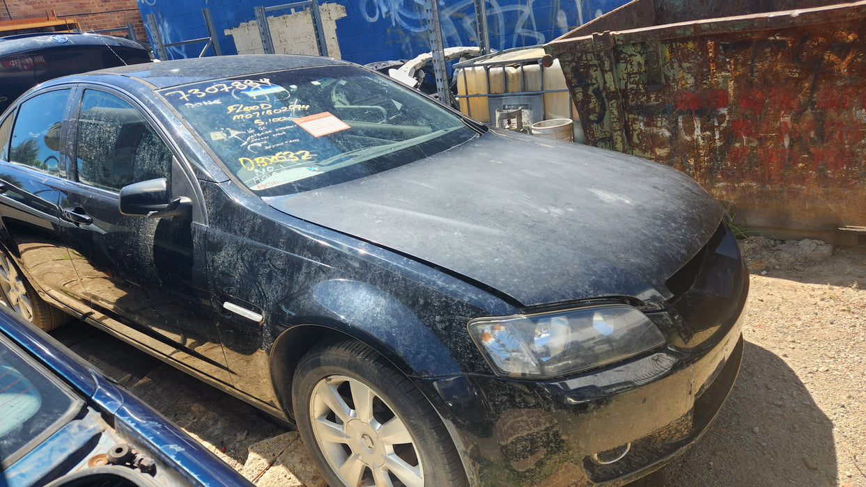 A009 - VE HOLDEN COMMODORE SEDAN - FUEL FLAP - PHANTOM black #690F