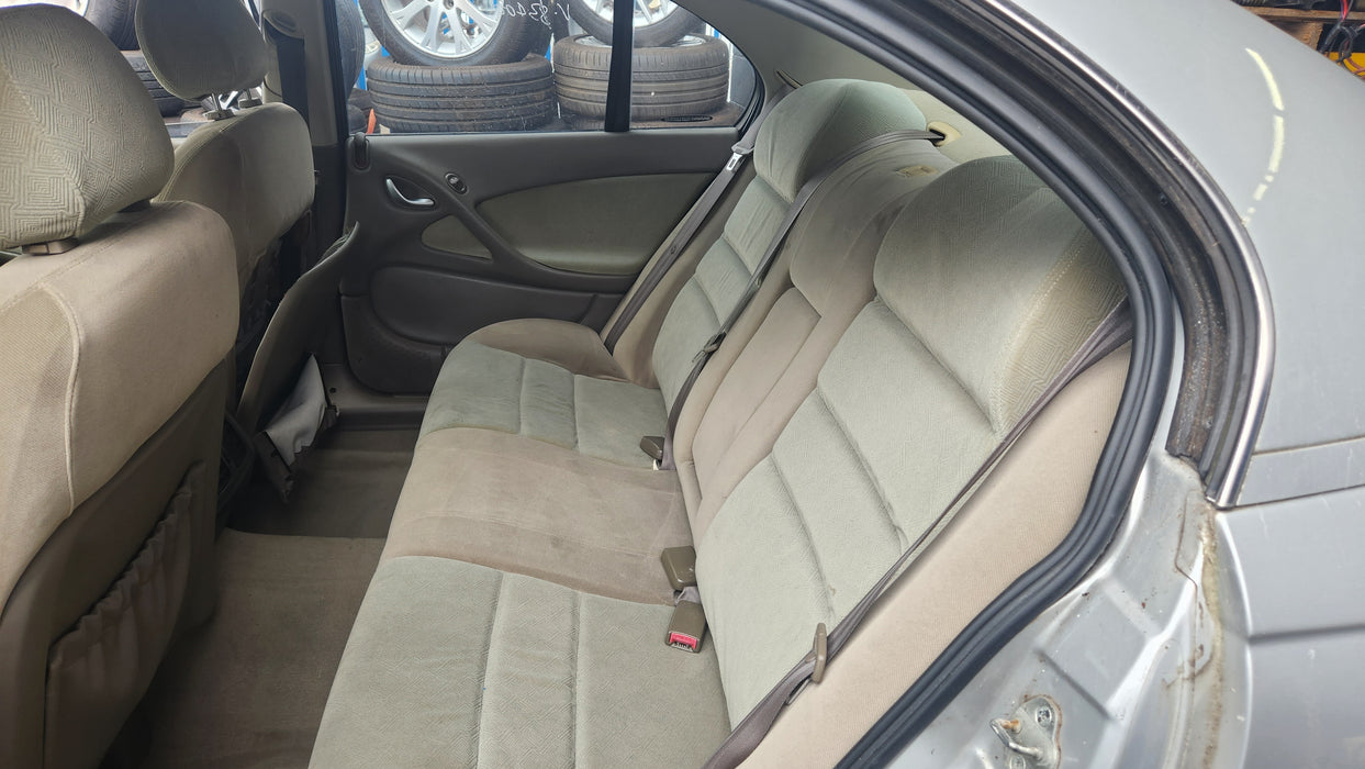 A085 - VZ,VY,VX,VT HOLDEN COMMODORE SEDAN - Drivers Rear Seatbelt Beige w/ Beige Bezel Trim