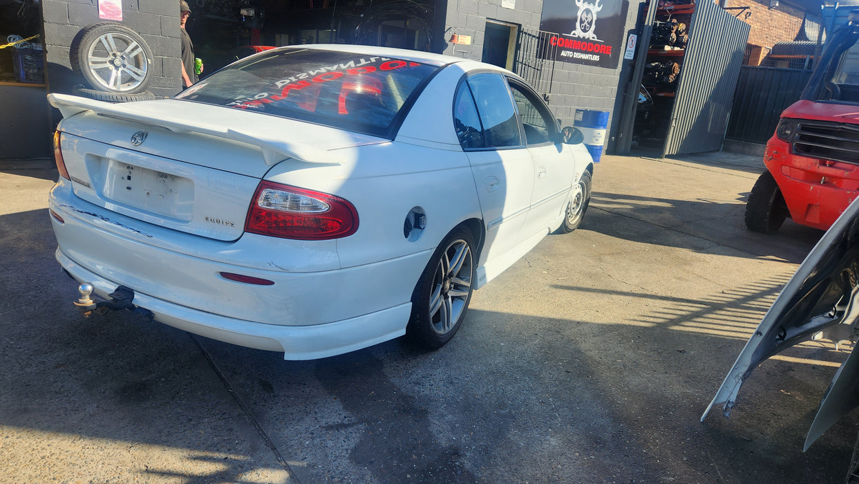 A131 - VX Holden Commodore SEDAN - REAR BAR with Skirt  HERON WHITE #J073