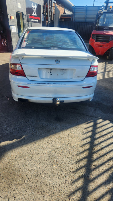 A131 - VX Holden Commodore SEDAN - REAR BAR with Skirt  HERON WHITE #J073