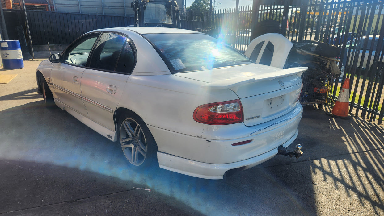 A131 - VX Holden Commodore SEDAN - REAR BAR with Skirt  HERON WHITE #J073