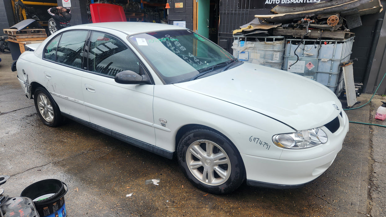 A136 - VX HOLDEN COMMODORE SEDAN - DRIVER'S REAR DOOR - PAINT CODE HERON WHITE #J073