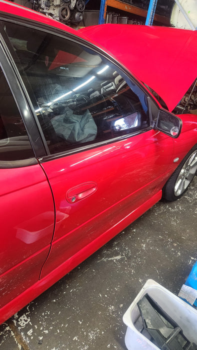 A141- VZ Holden Commodore - Door, Drivers Side Front (sting red)