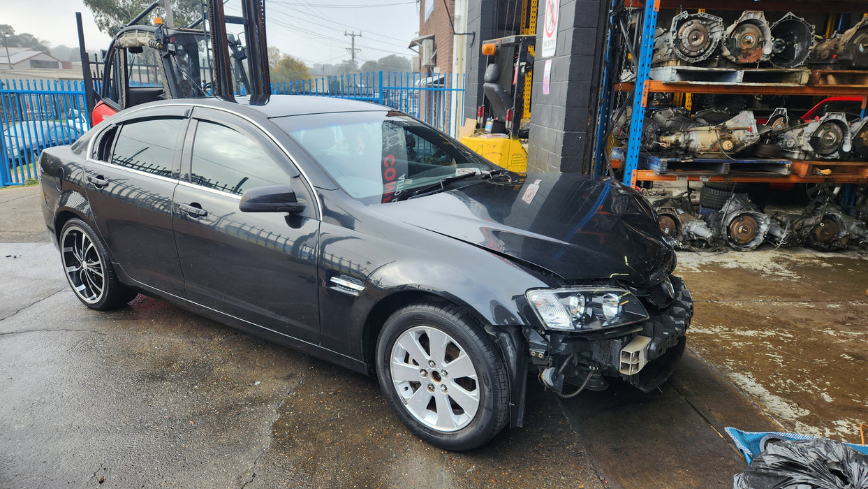 A143 - VE HOLDEN COMMODORE Sedan - Fuel Flap PHANTOM BLACK #690F
