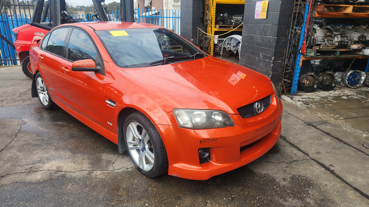 A158 - VE HOLDEN COMMODORE SEDAN - FUEL FLAP - IGNITION ORANGE #34IN