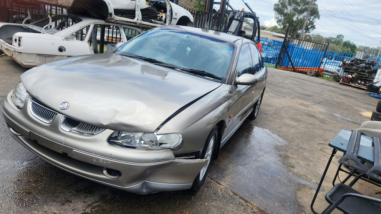 A177 - VT V6 HOLDEN COMMODORE SEDAN - DRIVERS REAR DOOR - PAINT CODE TUNGSTEN METALLIC #H114