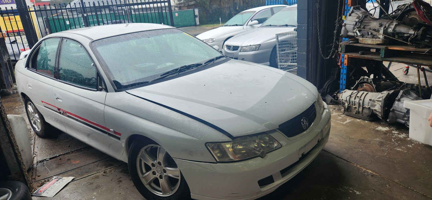 A197 - VY Holden S-Pac Sedan - Boot Garnish - HERON WHITE #679F