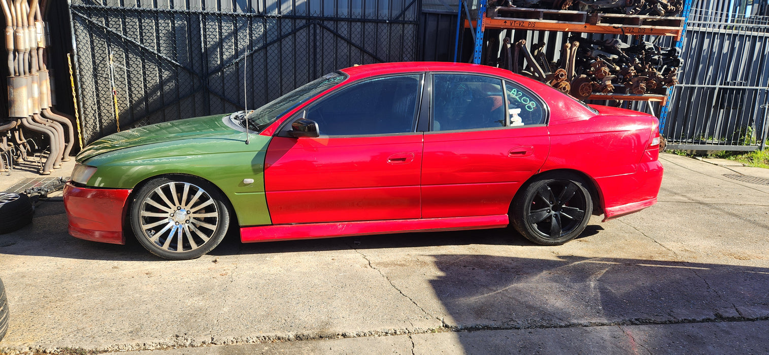 A208 - VY HOLDEN COMMODORE S-PAC SEDAN - BOOT GARNISH - STING RED #687F
