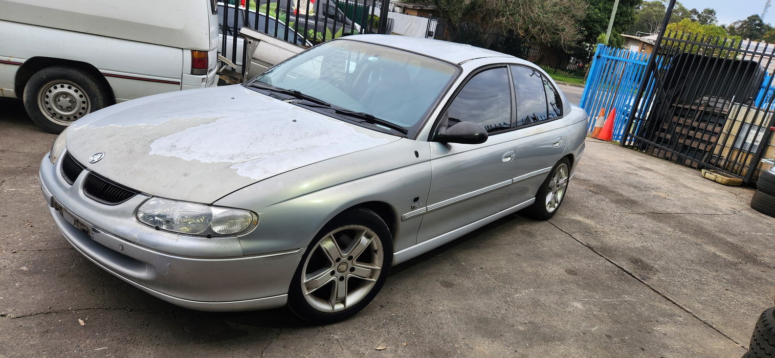 A212 - VT,VX,VY,VZ HOLDEN COMMODORE SEDAN - Seatbelt Centre Rear (Black)
