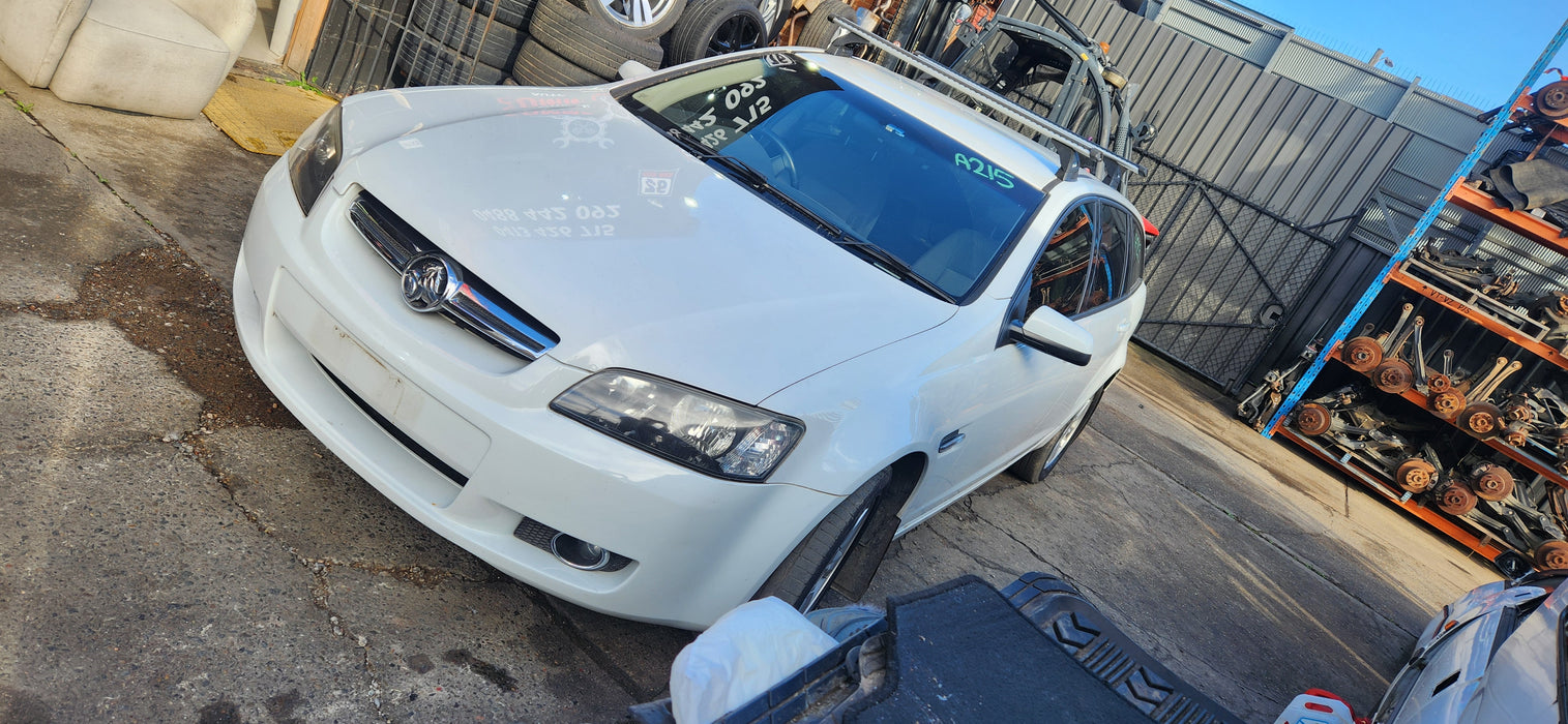 A215 - VE HOLDEN COMMODORE BERLINA WAGON S1 - Fuel Flap HERRON WHITE #679F