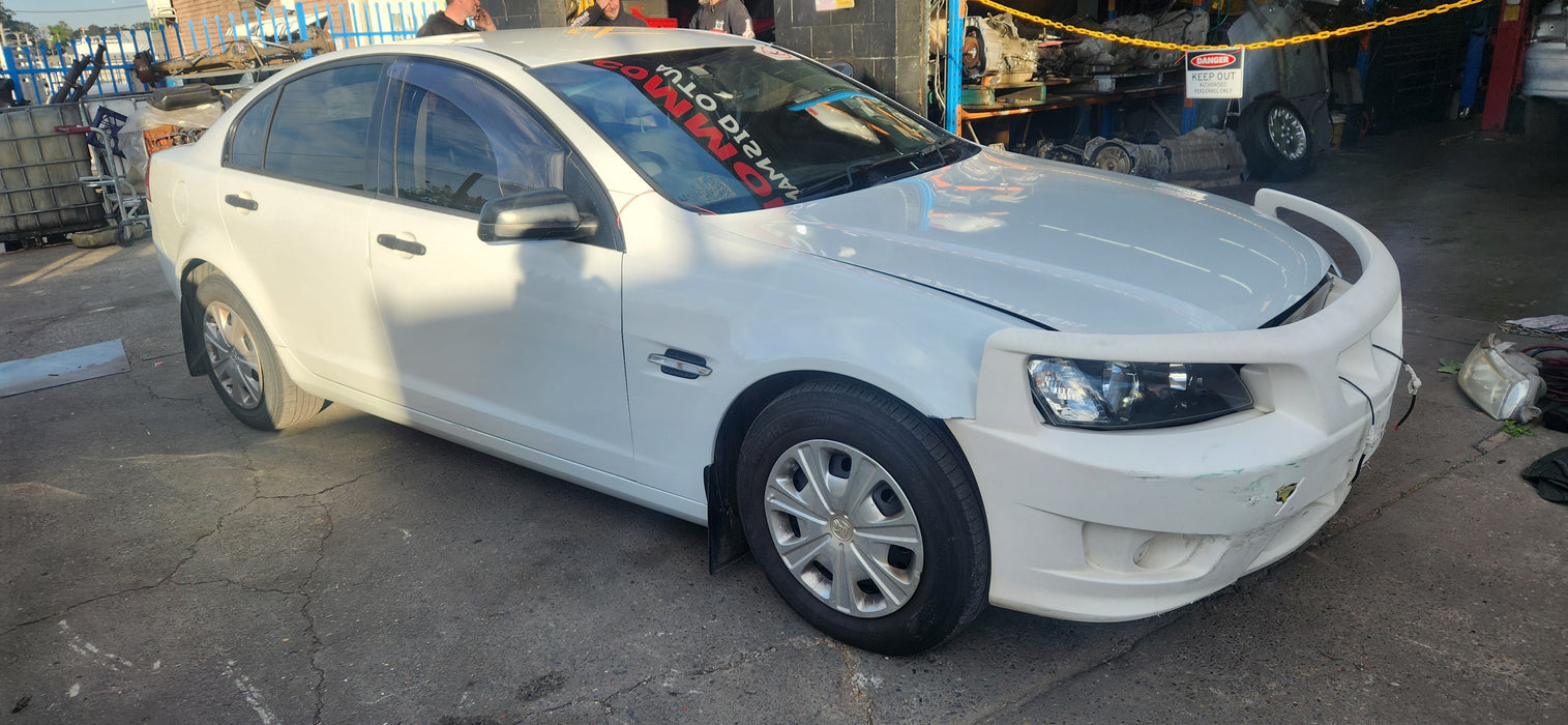 A223 - VE HOLDEN COMMODORE OMEGA SEDAN - Fuel Flap HERRON WHITE #679F