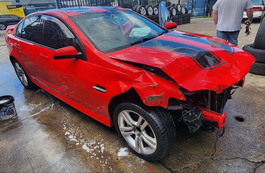 A228 - VE HOLDEN COMMODORE Sedan - Fuel Flap STING RED #687F