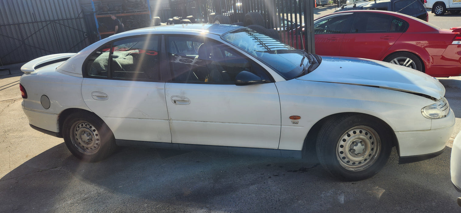 A231 - VT / VX Holden Commodore SEDAN - Rear Driver's Door (POWER WINDOWS) - HERON WHITE #J023