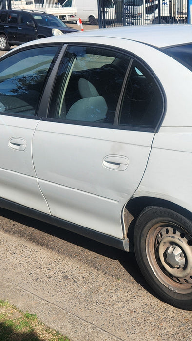 A231 - VT / VX Holden Commodore SEDAN - Rear Passenger's Door (POWER WINDOWS) - HERON WHITE #J023