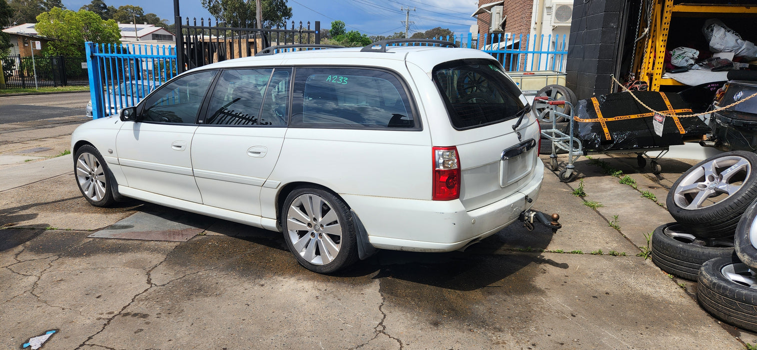 A233 - VZ HOLDEN COMMODORE WAGON - Sideskirt (PAIR) - HERON WHITE #679F