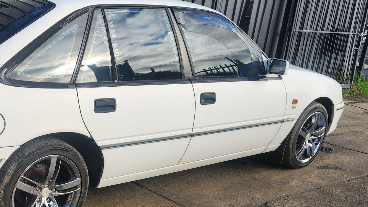 A257 - VS Holden Commodore SEDAN - Rear Door (MANUAL WINDOW) Driver's Rear - ALASKAN WHITE #J064