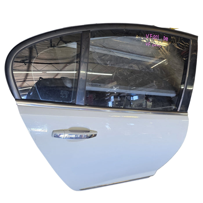 VF001 - VF Holden Calais V Sedan - Driver Rear Door with window glass, reg and ext. Door handle (POWER WINDOWS) - Heron White #679F