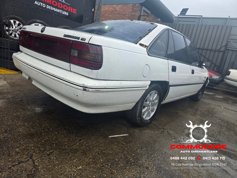 A292 - VP Holden Commodore SEDAN - Rear Lower Quarter Body Trim - DRIVERS SIDE - ALASKAN WHITE #J064
