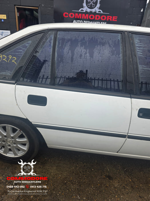 A292 - VP Holden Commodore SEDAN - Door Drivers Rear - ALASKIN WHITE #J064 MANUAL WINDOW REG