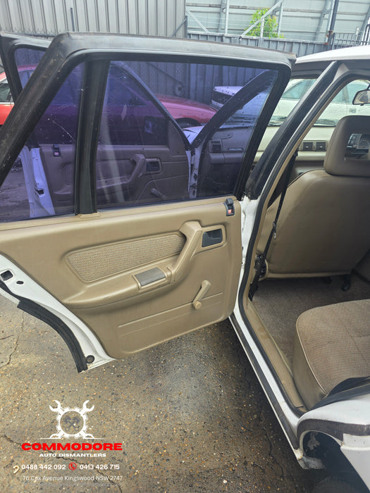 A292 - VP Holden Commodore SEDAN - Door Drivers Rear - ALASKIN WHITE #J064 MANUAL WINDOW REG