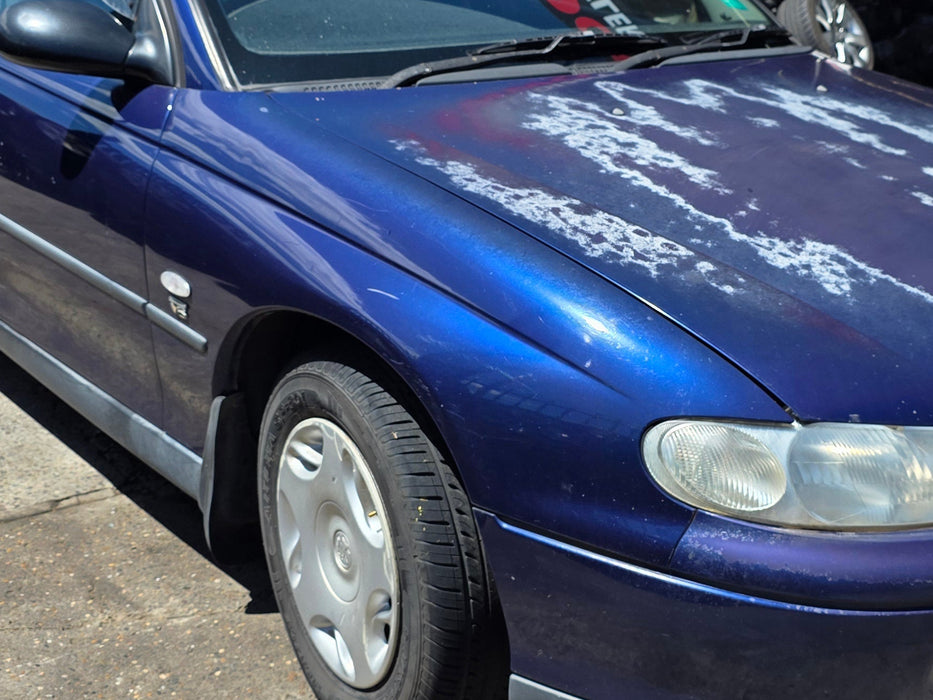 A301 - VT HOLDEN COMMODORE WAGON - Front Guard Driver's Front w/ "V6" ECOTEC Badge - BERMUDA BLUE #B168