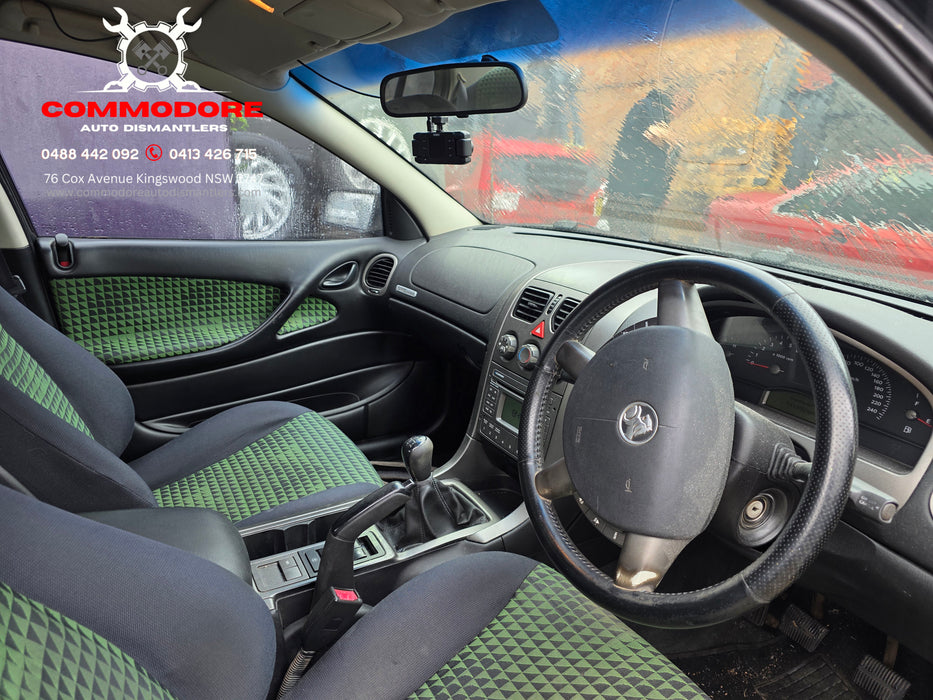 a297 - VY / VZ Holden Commodore S Sedan - Perforated Leather Steering Wheel with Airbag / Hornpad