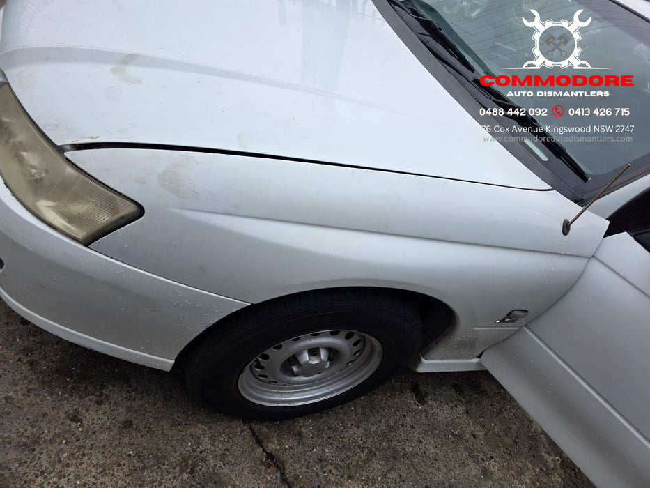 A303 - VZ Holden ONE TONNER Utility - Front Guard Passenger's Side - HERON WHITE #679F