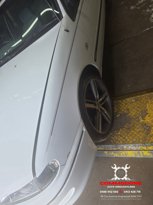 A306 - VR Holden Commodore Sedan - Passenger's Front Guard w/ Antenna Bezzel & Badge - ALASKAN WHITE #J064