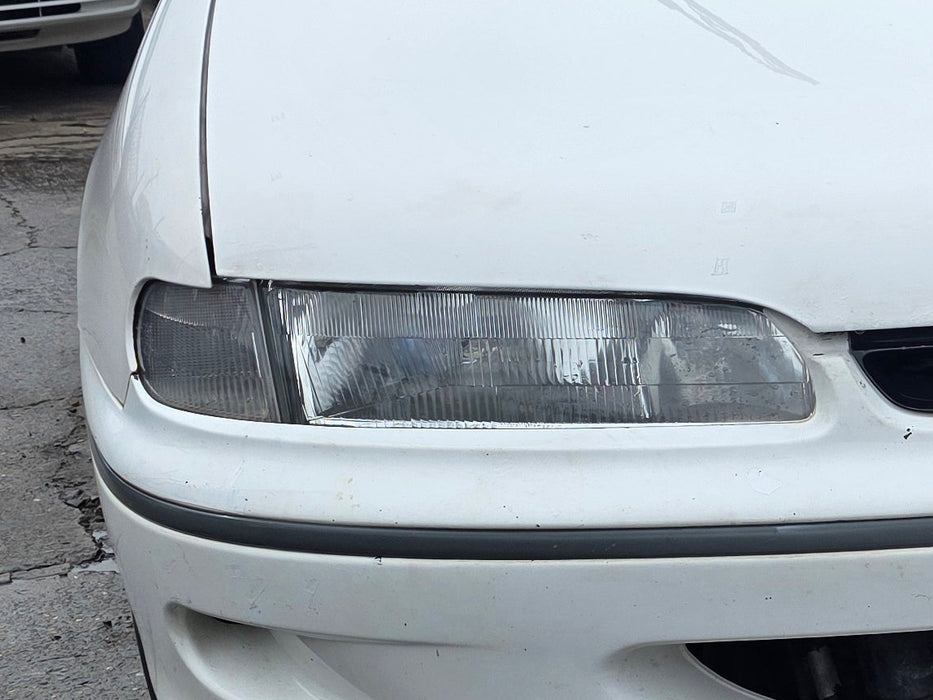 A305 - VR Holden Commodore SEDAN - Headlight w/ Blinker Driver's Side - GENUINE