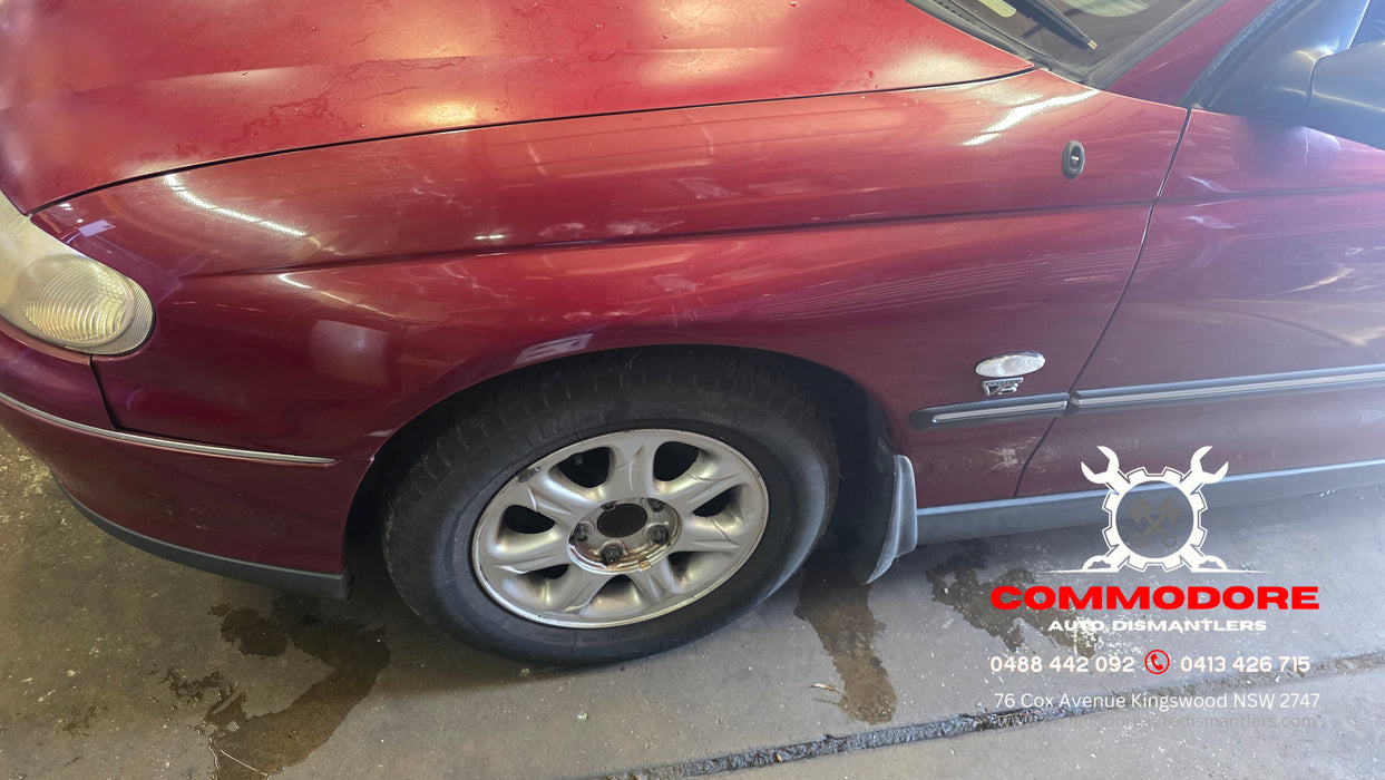 A315 - VT SERIES II Holden Commodore Sedan - Passenger's Front Guard w/ "V6" Badge & Guard Blinker - GRANADA RED #F129