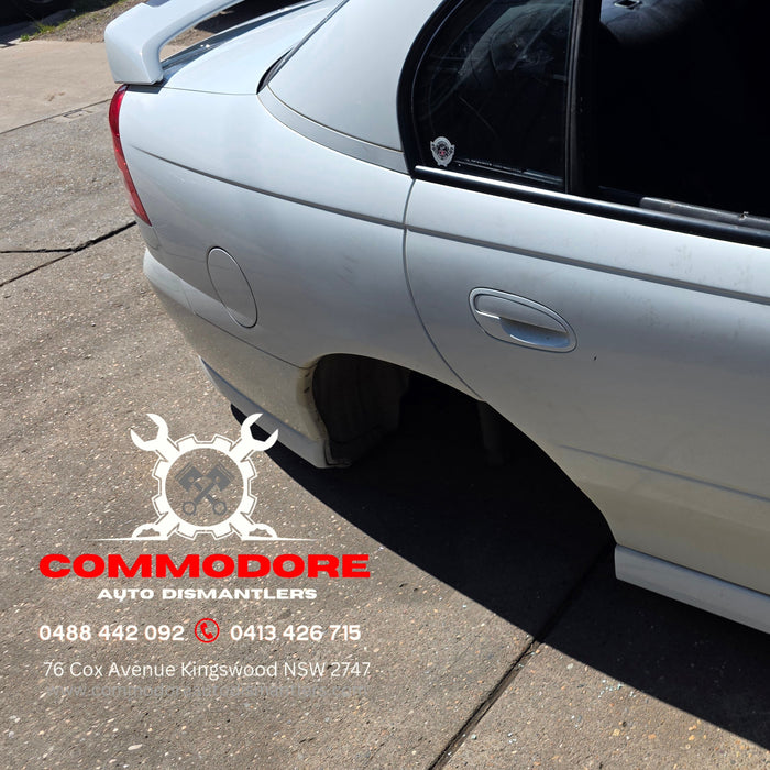 A345 - VZ SV6 Holden Commodore Sedan - Fuel Flap GENUINE - HERON WHITE #679F