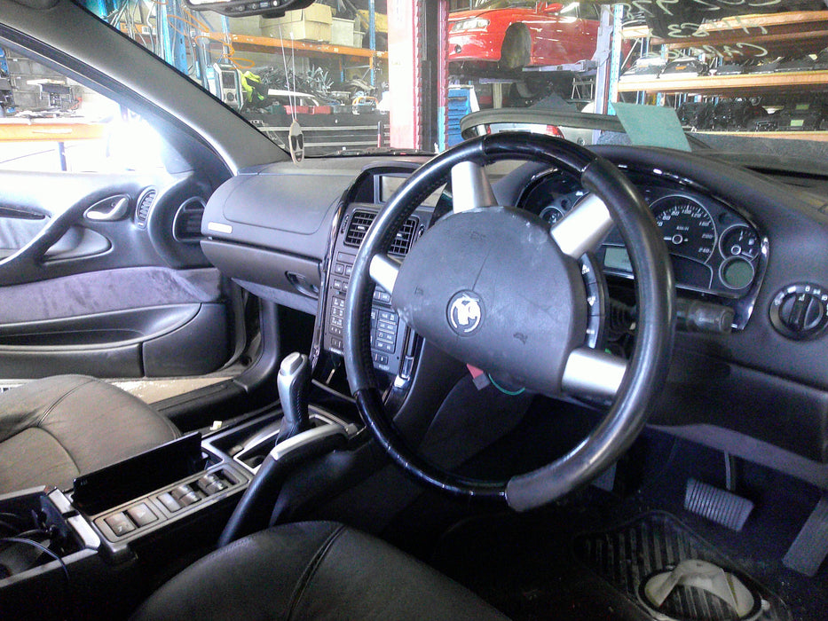 VT / VX Holden Commodore - DRIVER'S SIDE - Kick Panel / Black Plastic - Part #92047030
