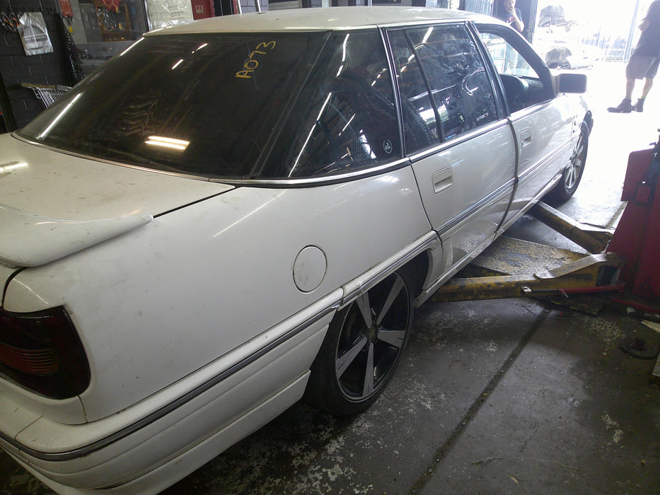 A073 - VQ Statesman Rear QRT Window Drivers Side