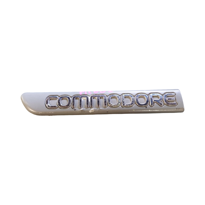 PIC002 - VR/VS Holden Commodore - "COMMODORE" Passenger's Front Guard Badge Genuine - GREY/CHROME 165mm