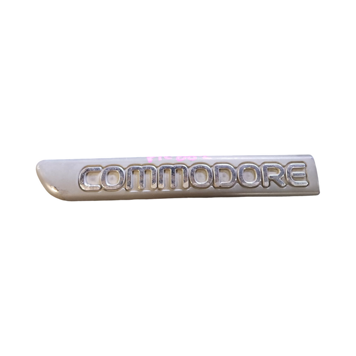 PIC002 - VR/VS Holden Commodore - "COMMODORE" Passenger's Front Guard Badge Genuine - GREY/CHROME 165mm