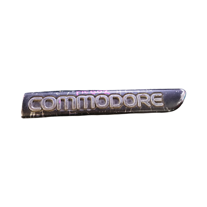 PIC002 - VR/VS Holden Commodore - "COMMODORE" Driver's Front Guard Badge Genuine - BLACK/CHROME 165mm