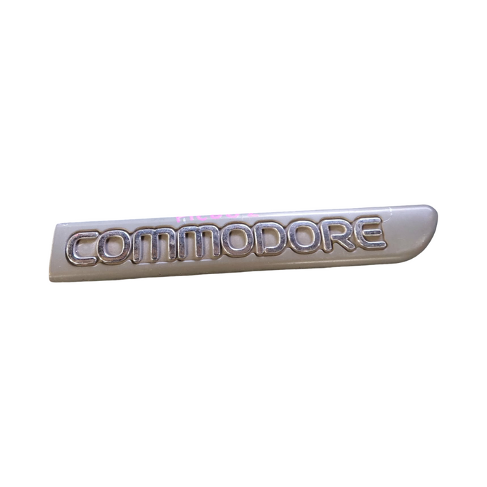 PIC002 - VR/VS Holden Commodore - "COMMODORE" Driver's Front Guard Badge Genuine - GREY/CHROME 165mm
