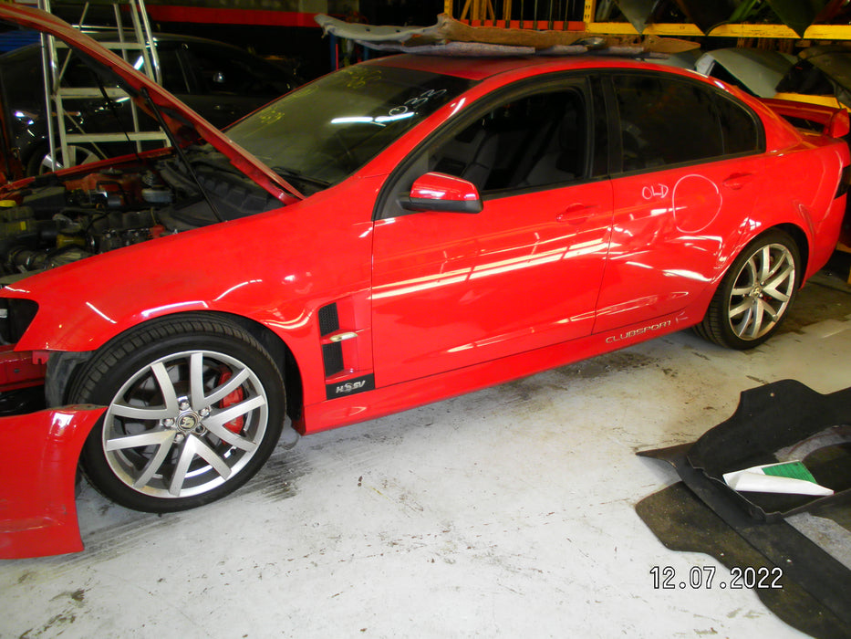 A033 - VE HOLDEN COMMODORE SEDAN - FUEL FLAP - STING RED #687F