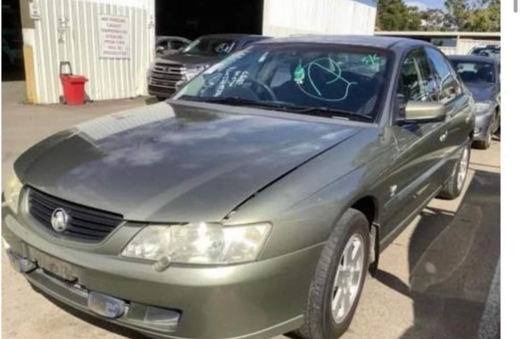 A020 - VY HOLDEN COMMODORE SEDAN Acclaim - Fuel Flap - MARTINI GREY METALIC #703H