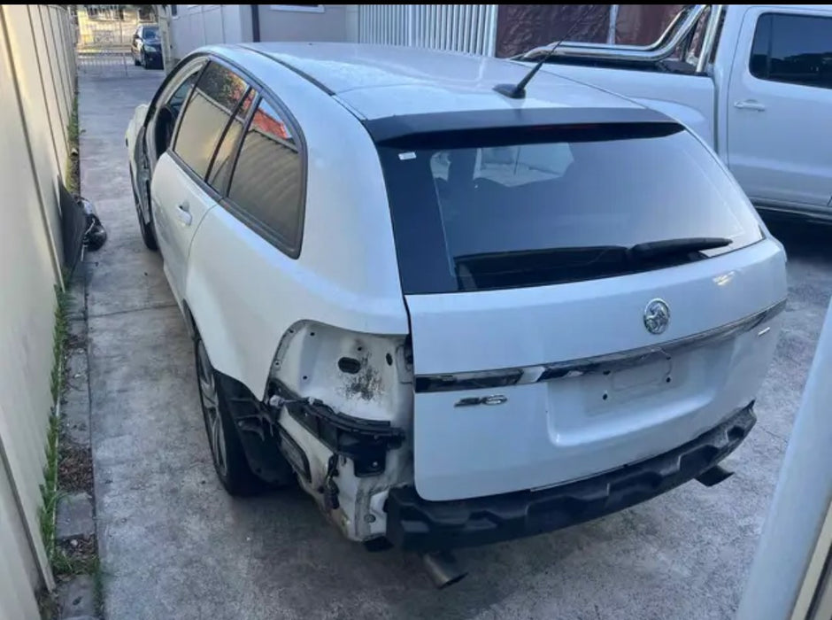 A193 - VF HOLDEN COMMODORE WAGON - DRIVER'S REAR DOOR - Herron White - #679F