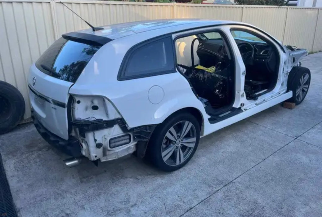 A193 - VF HOLDEN COMMODORE WAGON - DRIVER'S REAR DOOR - Herron White - #679F