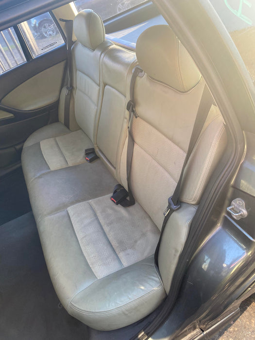 A148 - VT,VX,VY.VZ HOLDEN COMODORE WAGON - Seatbelt Drivers Rear (black) with Beige Plastic Bezel Trim